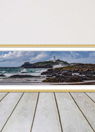 Godrevy Lighthouse with breaking waves at the shore. Cornwall. Framed picture