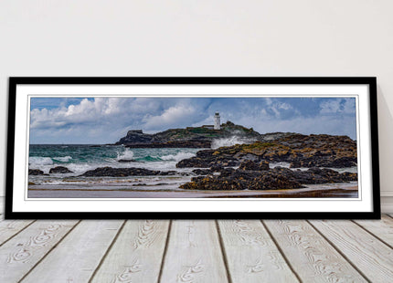 Godrevy Lighthouse with breaking waves at the shore. Cornwall. Framed picture