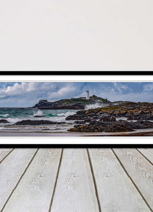 Godrevy Lighthouse with breaking waves at the shore. Cornwall. Framed picture