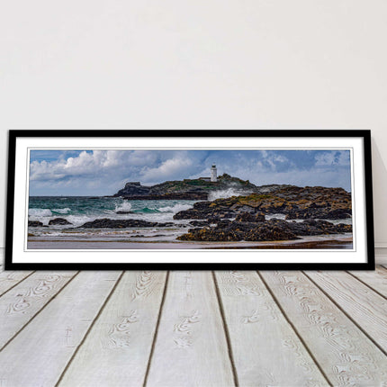 Godrevy Lighthouse with breaking waves at the shore. Cornwall. Framed picture