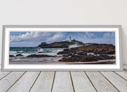 Godrevy Lighthouse with breaking waves at the shore. Cornwall. Framed picture