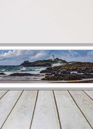 Godrevy Lighthouse with breaking waves at the shore. Cornwall. Framed picture