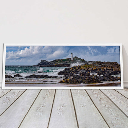 Godrevy Lighthouse with breaking waves at the shore. Cornwall. Framed picture