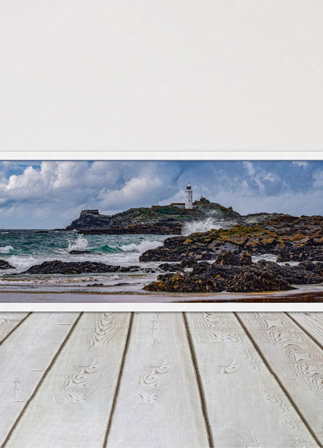 Godrevy Lighthouse with breaking waves at the shore. Cornwall. Framed picture