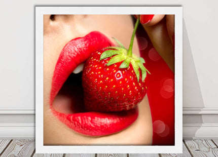 Strawberry red lips eating framed picture print with choice frame colours