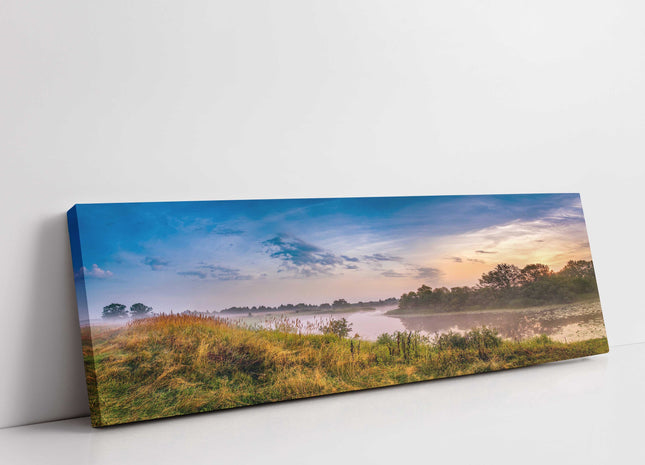River in the countryside. Sunrise and morning mist. Panoramic canvas picture.