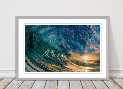 Sunset in the surf. Framed picture print with a choice of frame colours.