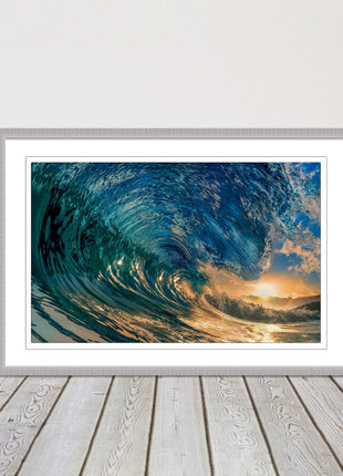 Sunset in the surf. Framed picture print with a choice of frame colours.