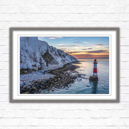 Sunrise at Beachy Head Lighthouse. Framed picture in a choice of styles.