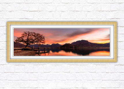 Sunset across the lake. Panoramic framed in a picture frame with choice of colours