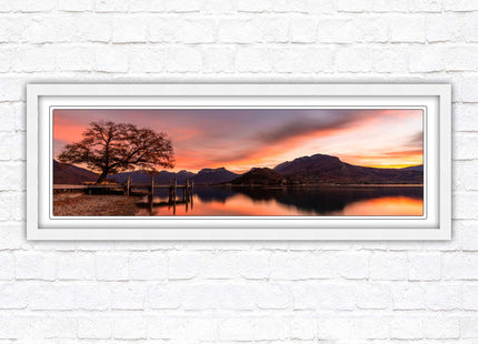 Sunset across the lake. Panoramic framed in a picture frame with choice of colours