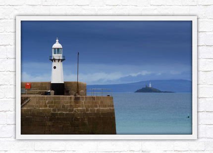 St Ives harbour lighthouse. Framed picture print with a choice of frame colours. Beach seascape