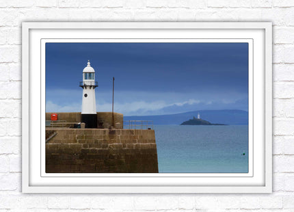 St Ives harbour lighthouse. Framed picture print with a choice of frame colours. Beach seascape