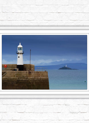 St Ives harbour lighthouse. Framed picture print with a choice of frame colours. Beach seascape