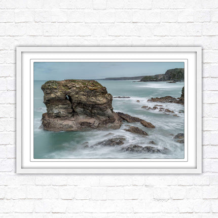 Cornish coastline near Porth Island. Framed picture print with choice of frame colours