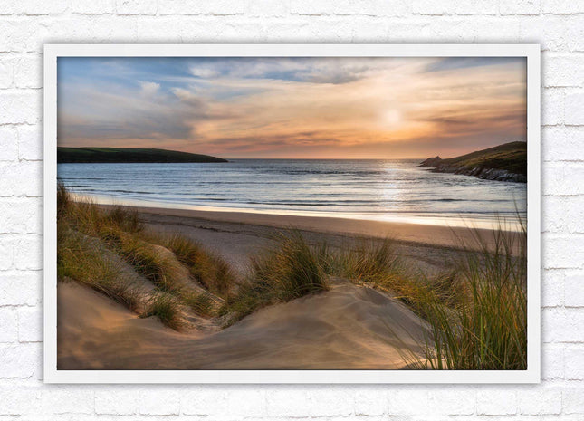 Crantock Beach. Sunlight over the sand dunes, North Cornwall coast. Framed picture print with choice of frame colours