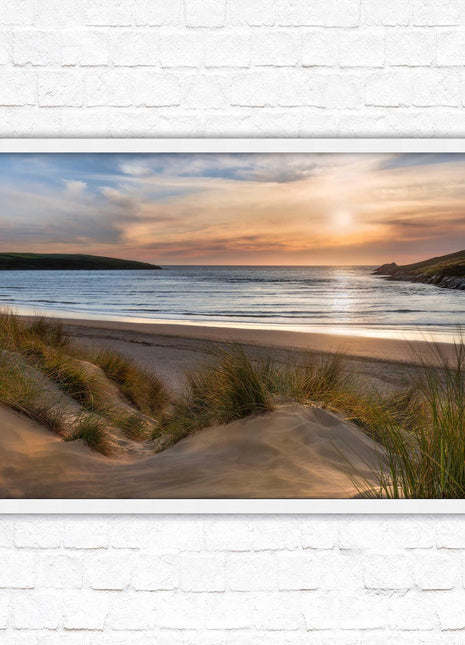 Crantock Beach. Sunlight over the sand dunes, North Cornwall coast. Framed picture print with choice of frame colours