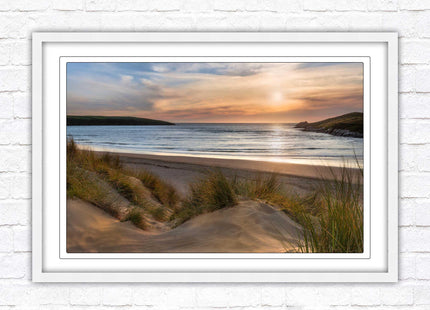 Crantock Beach. Sunlight over the sand dunes, North Cornwall coast. Framed picture print with choice of frame colours