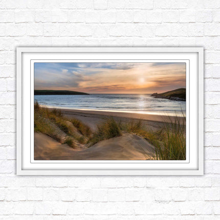 Crantock Beach. Sunlight over the sand dunes, North Cornwall coast. Framed picture print with choice of frame colours
