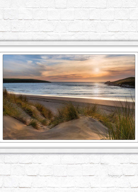 Crantock Beach. Sunlight over the sand dunes, North Cornwall coast. Framed picture print with choice of frame colours
