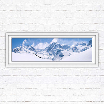 Swiss Alps mountain range. Panoramic framed picture print. Vibrant blue and white image. Choice of frame colours.