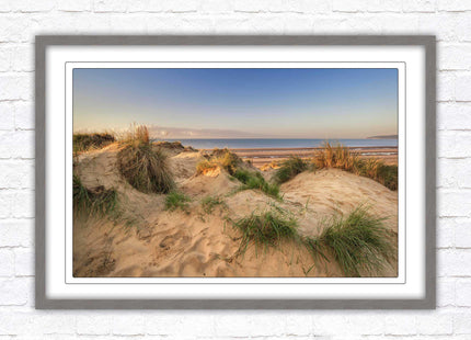Sunrise over the sand dunes. Framed picture print. Coastal scenery.