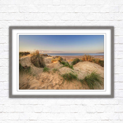 Sunrise over the sand dunes. Framed picture print. Coastal scenery.