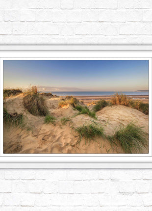 Sunrise over the sand dunes. Framed picture print. Coastal scenery.