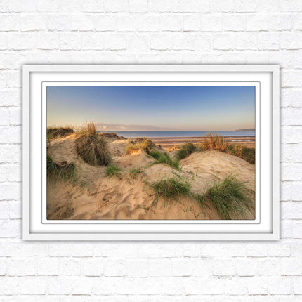 Sunrise over the sand dunes. Framed picture print. Coastal scenery.