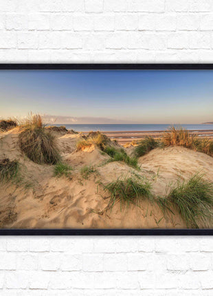 Sunrise over the sand dunes. Framed picture print. Coastal scenery.