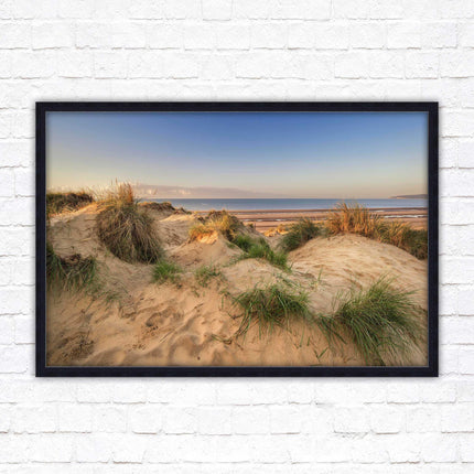 Sunrise over the sand dunes. Framed picture print. Coastal scenery.