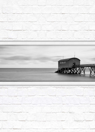 Lifeboat station at sea. Panoramic framed picture print. Black and white image. A choice of picture frames.