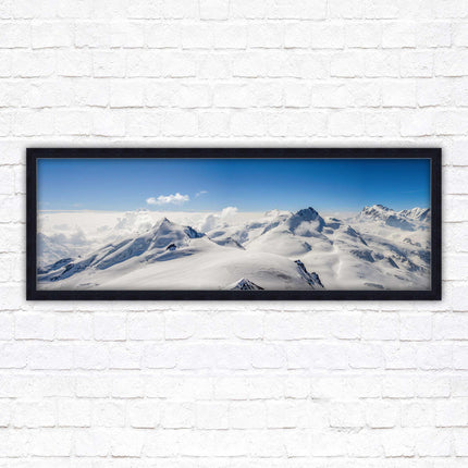 Swiss Alps mountain landscape. Panoramic framed picture print. Vibrant blue and white image. Choice of frame colours.