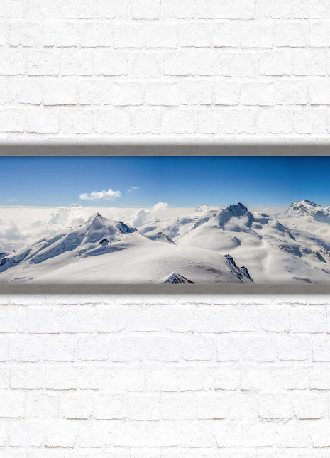 Swiss Alps mountain landscape. Panoramic framed picture print. Vibrant blue and white image. Choice of frame colours.