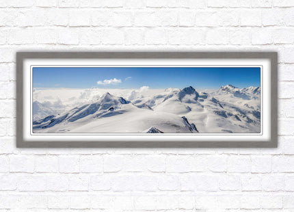 Swiss Alps mountain landscape. Panoramic framed picture print. Vibrant blue and white image. Choice of frame colours.