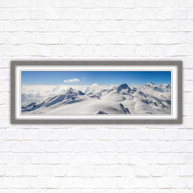 Swiss Alps mountain landscape. Panoramic framed picture print. Vibrant blue and white image. Choice of frame colours.