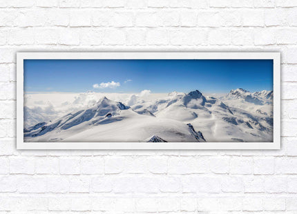 Swiss Alps mountain landscape. Panoramic framed picture print. Vibrant blue and white image. Choice of frame colours.