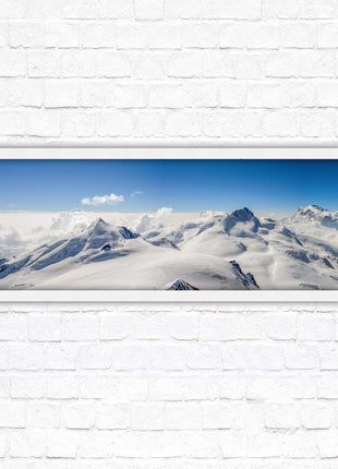 Swiss Alps mountain landscape. Panoramic framed picture print. Vibrant blue and white image. Choice of frame colours.