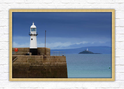 St Ives harbour lighthouse. Framed picture print with a choice of frame colours. Beach seascape