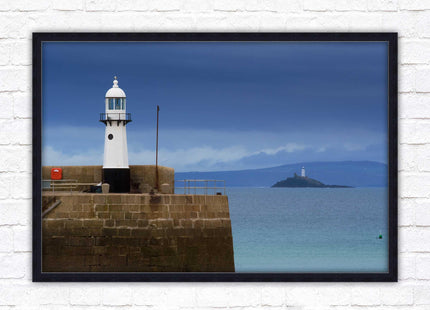 St Ives harbour lighthouse. Framed picture print with a choice of frame colours. Beach seascape
