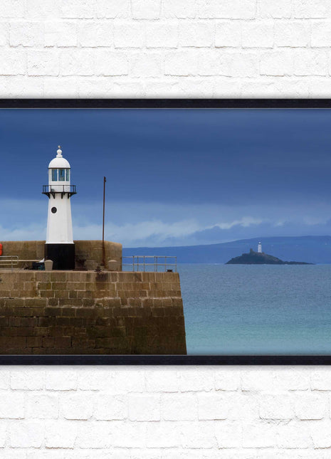St Ives harbour lighthouse. Framed picture print with a choice of frame colours. Beach seascape