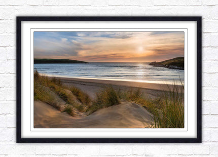 Crantock Beach. Sunlight over the sand dunes, North Cornwall coast. Framed picture print with choice of frame colours