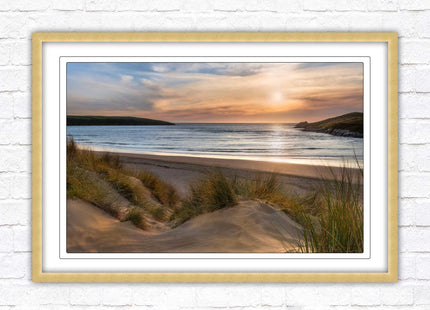Crantock Beach. Sunlight over the sand dunes, North Cornwall coast. Framed picture print with choice of frame colours