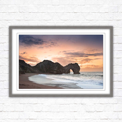 Durdle Door at sunset. Jurassic coast, Dorset. Framed picture print with choice of frame colours