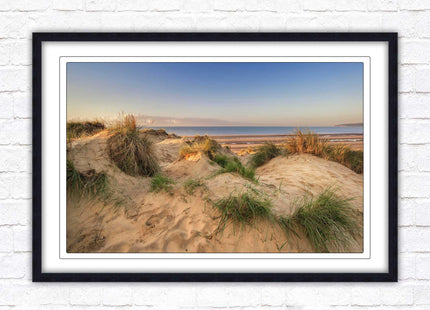 Sunrise over the sand dunes. Framed picture print. Coastal scenery.