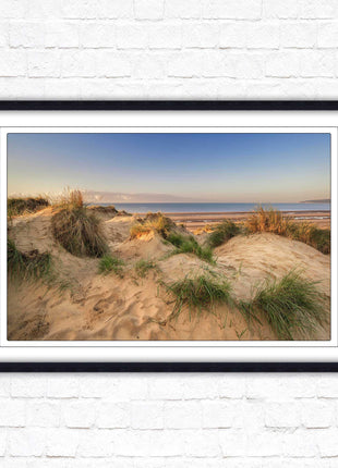 Sunrise over the sand dunes. Framed picture print. Coastal scenery.