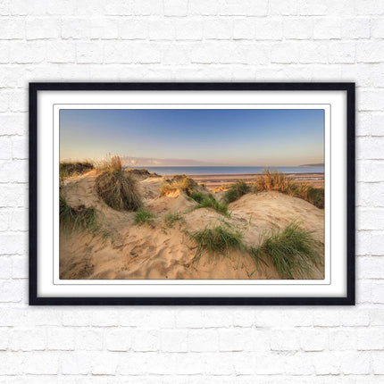 Sunrise over the sand dunes. Framed picture print. Coastal scenery.