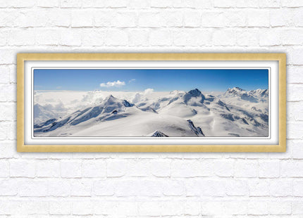 Swiss Alps mountain landscape. Panoramic framed picture print. Vibrant blue and white image. Choice of frame colours.