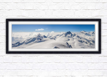 Swiss Alps mountain landscape. Panoramic framed picture print. Vibrant blue and white image. Choice of frame colours.