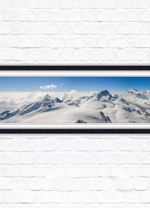 Swiss Alps mountain landscape. Panoramic framed picture print. Vibrant blue and white image. Choice of frame colours.